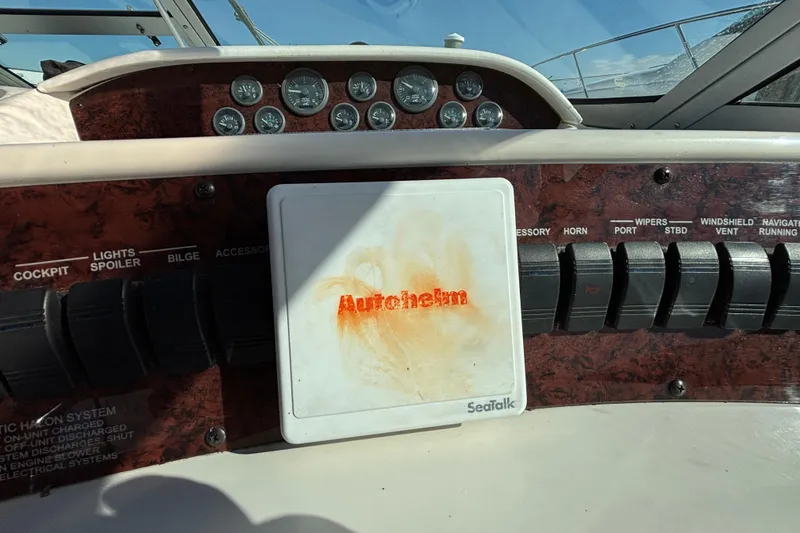 Slide: The Image of Control panel of a 1995 Sea Ray 330 Sundancer boat with Autohelm system. - 10