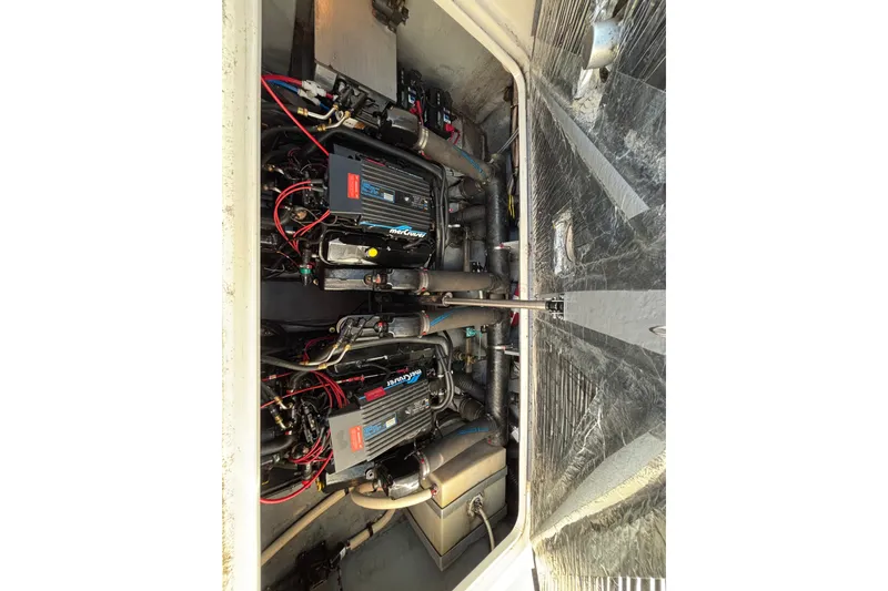 Slide: The Image of Engine compartment of a 1995 Sea Ray 330 Sundancer with dual MerCruiser engines. - 16