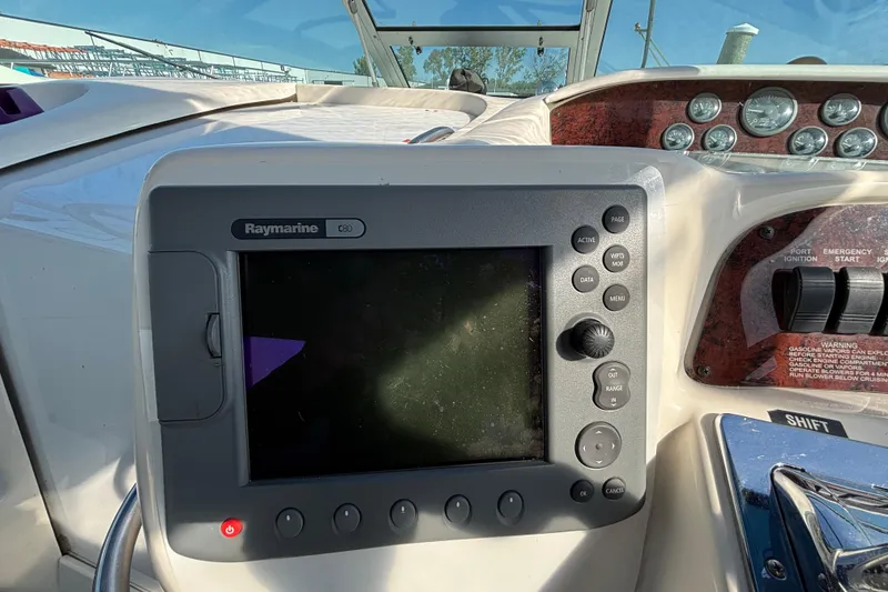 Slide: The Image of 1995 Sea Ray 330 Sundancer dashboard with Raymarine C80 navigation system. - 9