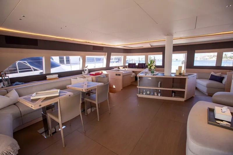 Slide: The Image of Luxurious interior of 2021 Lagoon Seventy 7 yacht with modern furnishings and panoramic windows. - 11