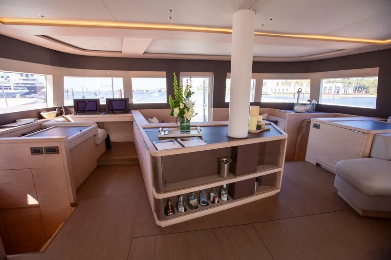 Slide: The Image of Luxurious interior of 2021 Lagoon Seventy 7 yacht with modern design and panoramic windows. - 12