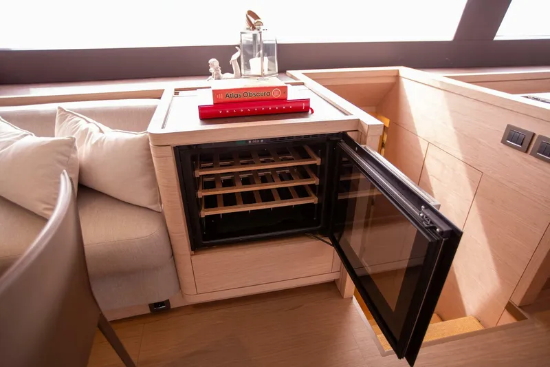 Slide: The Image of Luxurious interior of 2021 Lagoon Seventy 7 yacht with open wine cooler. - 13