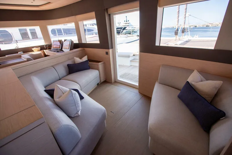 Slide: The Image of Luxurious interior of 2021 Lagoon Seventy 7 yacht with elegant seating and ocean view. - 16