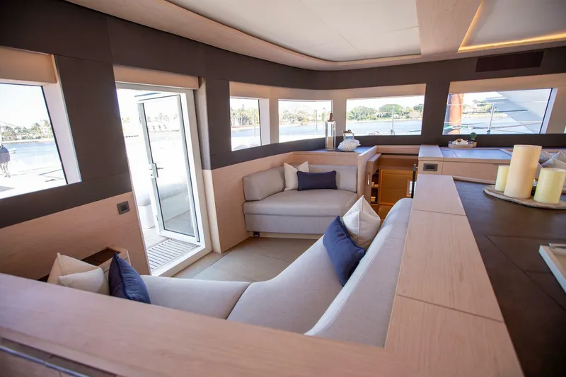 Slide: The Image of Luxurious interior of 2021 Lagoon Seventy 7 yacht with modern seating and panoramic windows. - 20