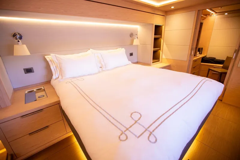 Slide: The Image of Luxurious bedroom interior of 2021 Lagoon Seventy 7 yacht with elegant bedding. - 22