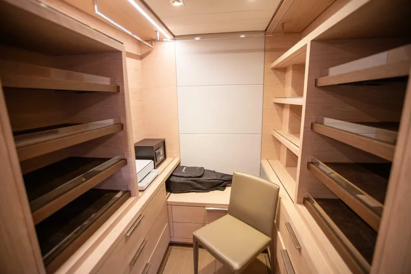 Slide: The Image of Luxurious wooden closet interior on a 2021 Lagoon Seventy 7 yacht. - 23