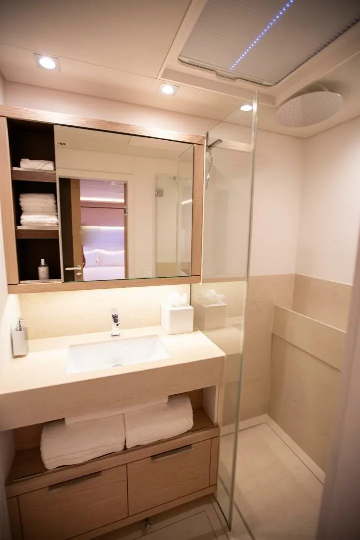 Slide: The Image of Luxurious bathroom in 2021 Lagoon Seventy 7 yacht with modern fixtures and elegant design. - 27