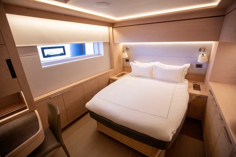 Slide: The Image of Luxurious cabin interior of 2021 Lagoon Seventy 7 yacht with modern design and cozy bed. - 28