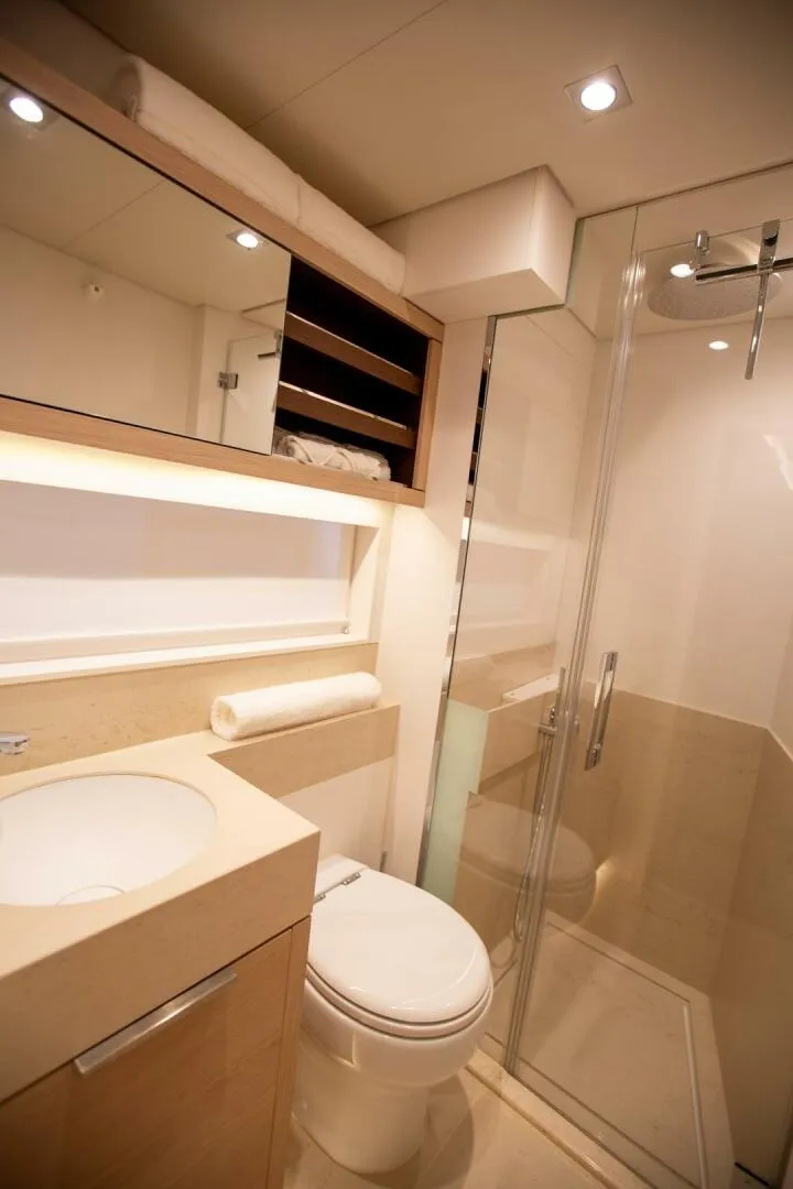 Slide: The Image of Luxurious bathroom in 2021 Lagoon Seventy 7 yacht with modern fixtures and glass shower. - 31