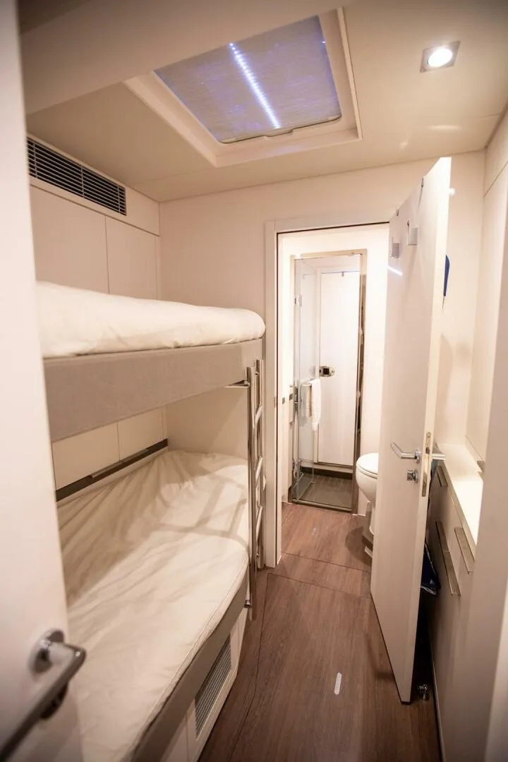 Slide: The Image of Interior of 2021 Lagoon Seventy 7 yacht with bunk beds and modern bathroom. - 37