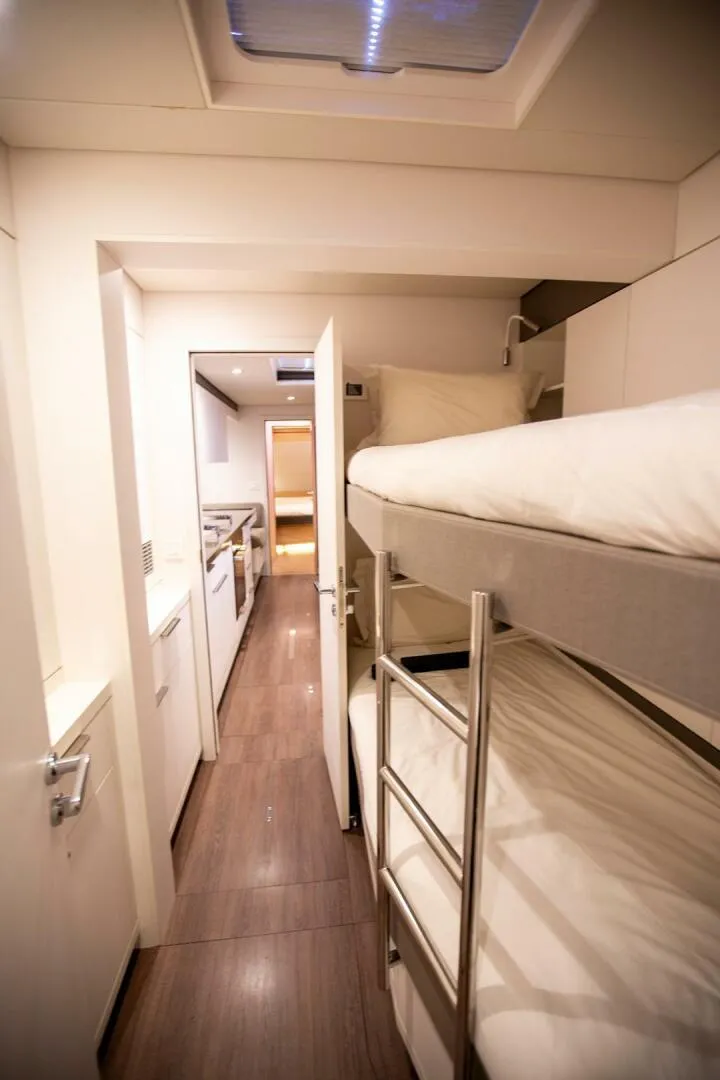 Slide: The Image of Interior of 2021 Lagoon Seventy 7 yacht with bunk beds and modern design. - 39