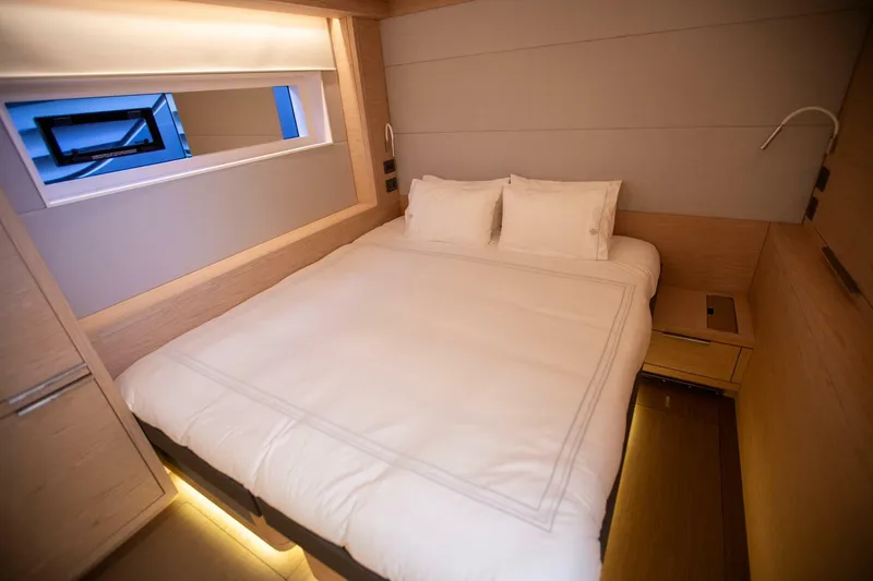 Slide: The Image of Luxurious bedroom interior of 2021 Lagoon Seventy 7 yacht with modern design and ambient lighting. - 40