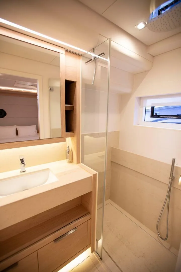 Slide: The Image of Luxurious bathroom in 2021 Lagoon Seventy 7 yacht with modern fixtures and glass shower. - 41