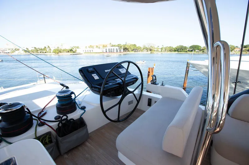 Slide: The Image of Helm of 2021 Lagoon Seventy 7 yacht with scenic water view. - 47