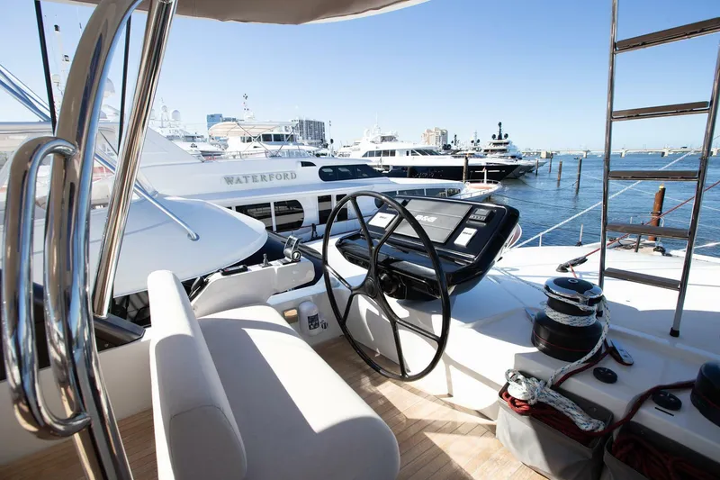 Slide: The Image of Cockpit view of 2021 Lagoon Seventy 7 yacht docked at marina. - 48
