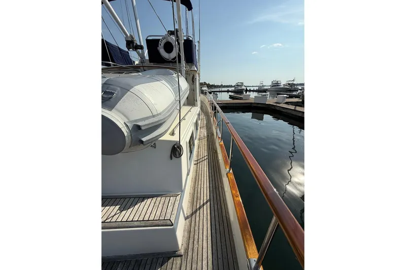 Slide: The Image of Teak table and seating on 1996 Grand Banks 42 Classic yacht deck. - 15