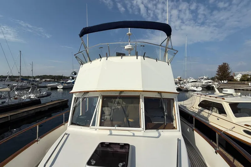 Slide: The Image of Teak deck of 1996 Grand Banks 42 Classic yacht with polished wood railings. - 24