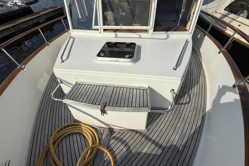 Slide: The Image of Side deck of 1996 Grand Banks 42 Classic yacht with wooden railings. - 25