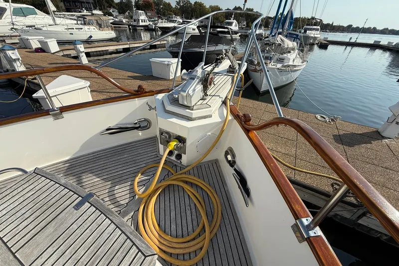 Slide: The Image of 1996 Grand Banks 42 Classic yacht detail with chrome horns and wooden accents. - 26