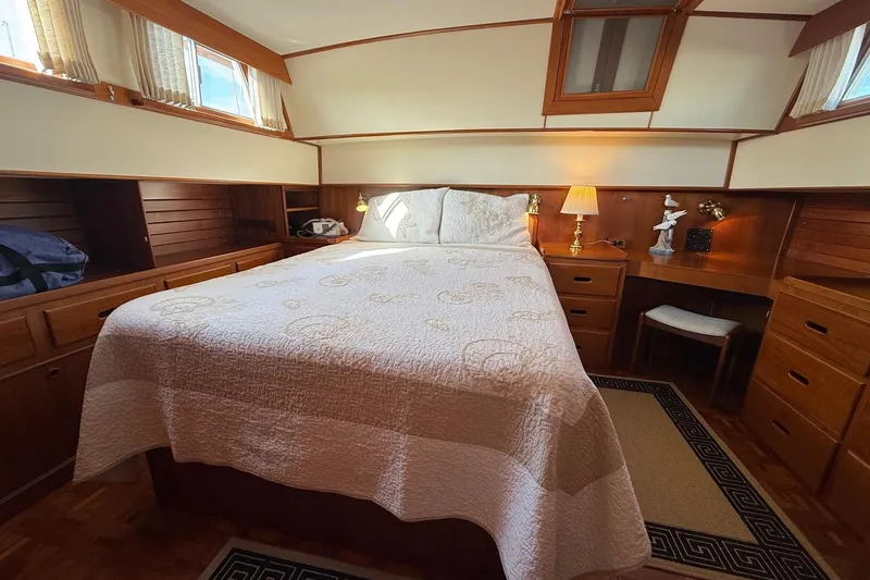 Slide: The Image of Bathroom interior of 1996 Grand Banks 42 Classic yacht, featuring sink, toilet, and wooden cabinetry. - 32