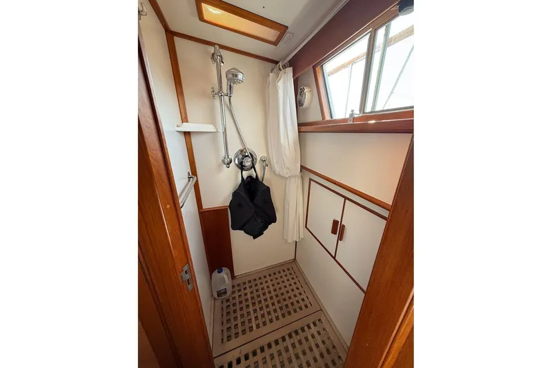 Slide: The Image of Cozy cabin interior of 1996 Grand Banks 42 Classic yacht with wooden furnishings. - 37