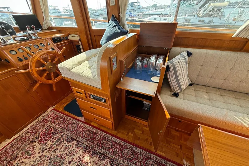 Slide: The Image of Interior view of 1996 Grand Banks 42 Classic yacht with wooden stairs and cozy cabin. - 43