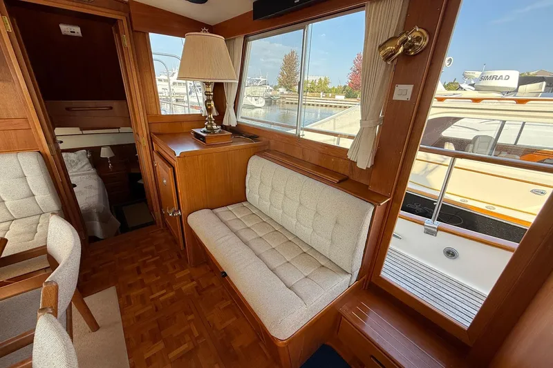 Slide: The Image of Interior of 1996 Grand Banks 42 Classic yacht with elegant wood dining area. - 46