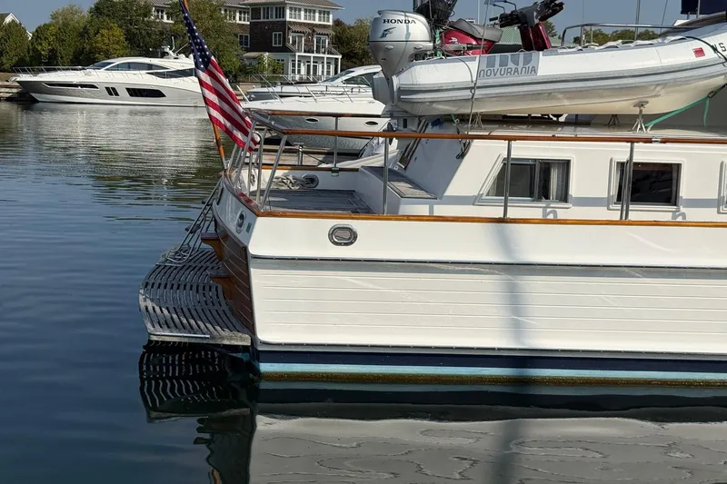 Slide: The Image of Cozy cabin interior of 1996 Grand Banks 42 Classic yacht with wooden furnishings. - 5