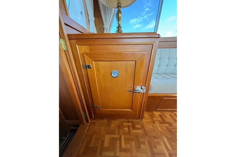 Slide: The Image of Wooden interior of 1996 Grand Banks 42 Classic yacht, featuring a small cabinet door. - 58