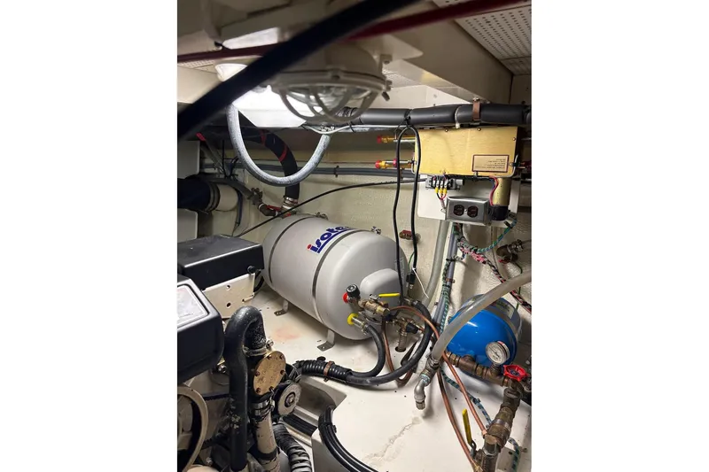 Slide: The Image of Engine room of 1996 Grand Banks 42 Classic with mechanical equipment and wiring. - 65