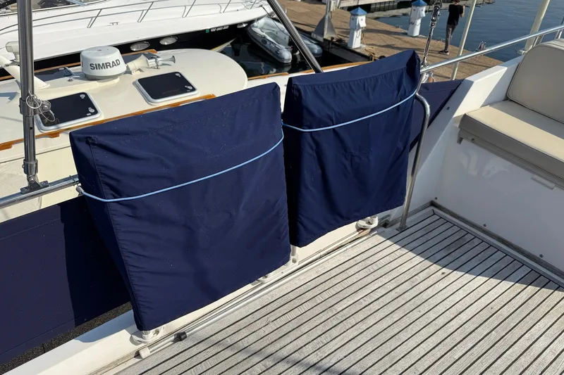 Slide: The Image of 1996 Grand Banks 42 Classic yacht docked at marina under clear sky. - 7