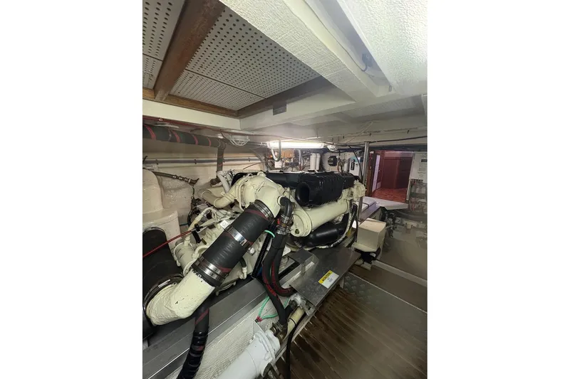 Slide: The Image of Engine room of 1996 Grand Banks 42 Classic yacht, showcasing detailed mechanical components. - 70