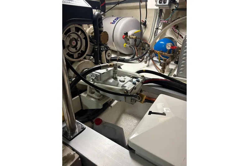 Slide: The Image of Engine room of 1996 Grand Banks 42 Classic, showcasing mechanical components and wiring. - 73