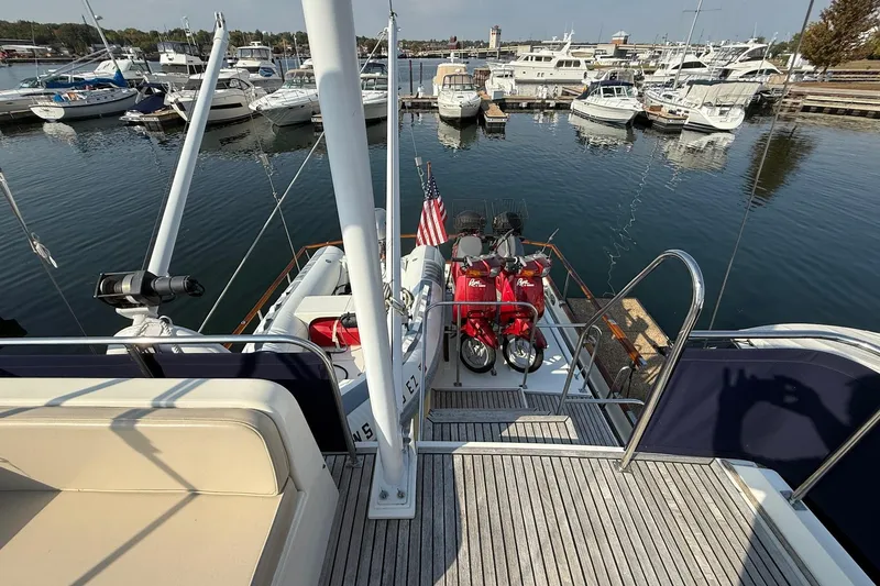 Slide: The Image of 1996 Grand Banks 42 Classic yacht docked in a marina under clear blue skies. - 8