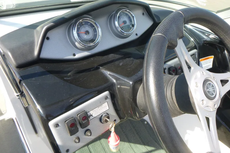 Slide: The Image of Dashboard of 2015 Yamaha Boats SX192 with steering wheel and gauges. - 13