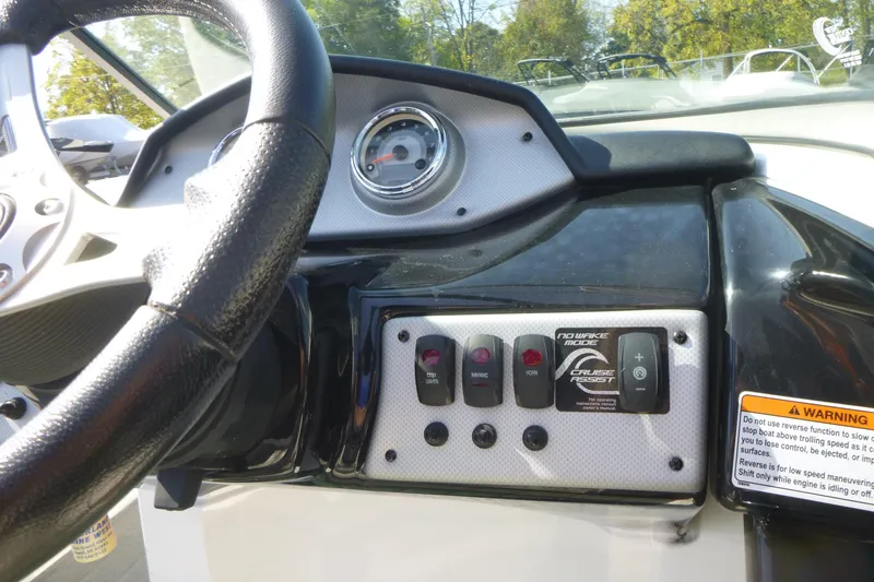Slide: The Image of 2015 Yamaha Boats SX192 dashboard with steering wheel and control panel. - 14