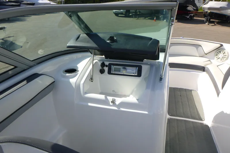 Slide: The Image of 2015 Yamaha Boats SX192 interior with seating and control panel. - 15