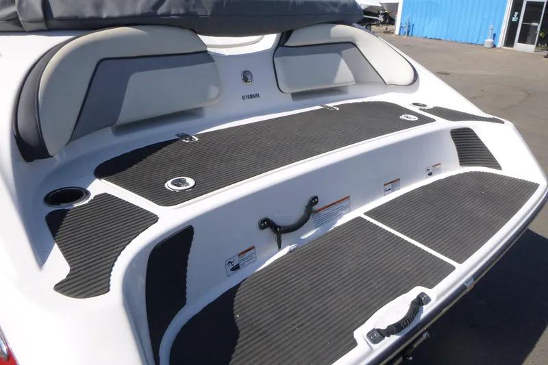 Slide: The Image of 2015 Yamaha Boats SX192 swim platform with cushioned seating and non-slip surface. - 4