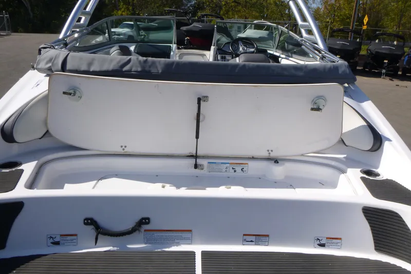 Slide: The Image of 2015 Yamaha Boats SX192 rear view, showcasing seating and storage area. - 5