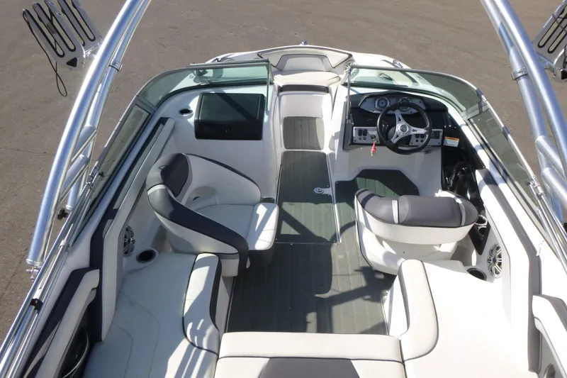 Slide: The Image of 2015 Yamaha Boats SX192 interior with sleek seating and modern dashboard design. - 7