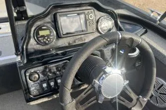 Slide: The Image of 2018 Starweld Fusion Pro 18 DC boat interior with motor and seating. - 4