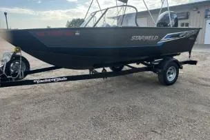 Slide: The Image of 2018 Starweld Fusion Pro 18 DC boat with Mercury outboard motor on trailer. - 5
