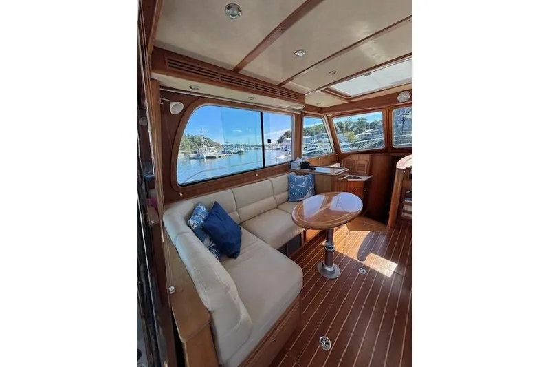 Slide: The Image of Interior of 2012 Sabre 42 Salon Express yacht with elegant wood finish and scenic window view. - 10