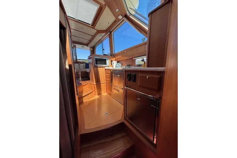 Slide: The Image of Interior of 2012 Sabre 42 Salon Express yacht with wood finish and modern amenities. - 15