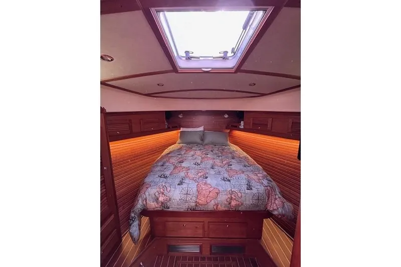 Slide: The Image of Luxurious cabin interior of 2012 Sabre 42 Salon Express with skylight and cozy bedding. - 20