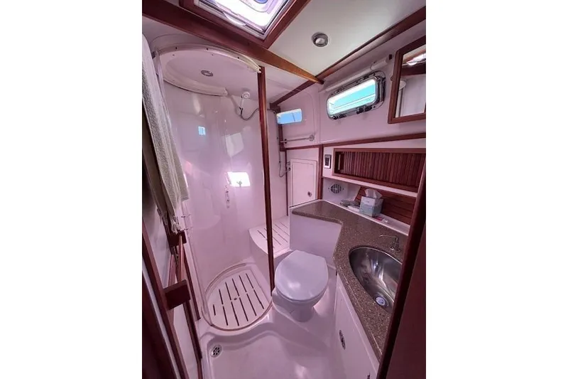 Slide: The Image of Luxurious bathroom in 2012 Sabre 42 Salon Express yacht with shower and sink. - 24