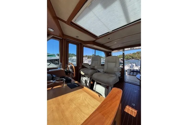 Slide: The Image of Interior of 2012 Sabre 42 Salon Express yacht with luxurious seating and wooden finishes. - 27