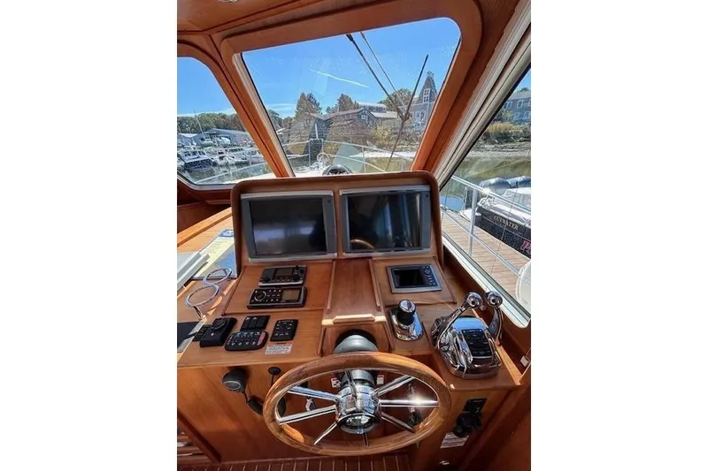 Slide: The Image of Helm of 2012 Sabre 42 Salon Express with dual screens and controls. - 28