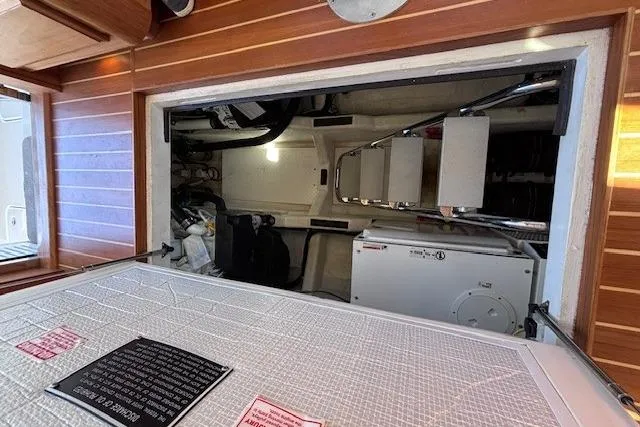 Slide: The Image of Engine room of 2012 Sabre 42 Salon Express yacht, showcasing mechanical components. - 33