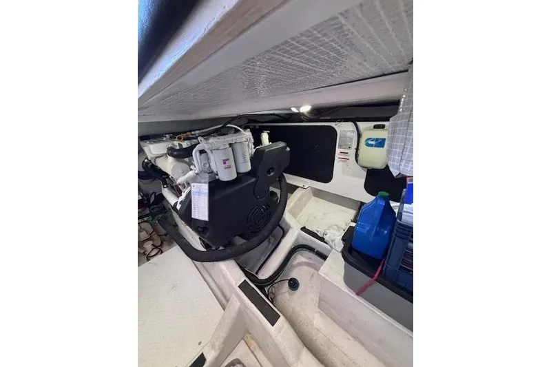 Slide: The Image of Engine room of 2012 Sabre 42 Salon Express with visible components and storage. - 35